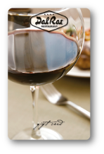 Vertical card with the Dal Rae logo over a background image of a glass of red wine.